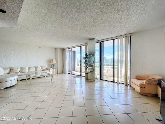 20225 NE 34th Ct Unit 817, Miami, FL 33810 - living room featuring a textured ceiling and expansive windows