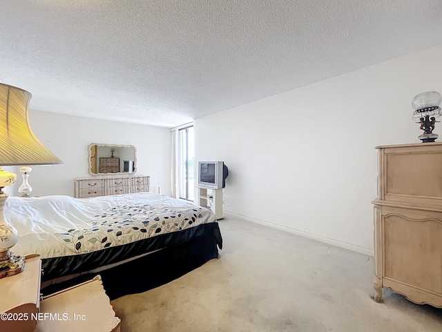20225 NE 34th Ct Unit 817, Miami, FL 33810 - carpeted bedroom featuring a textured ceiling and baseboards