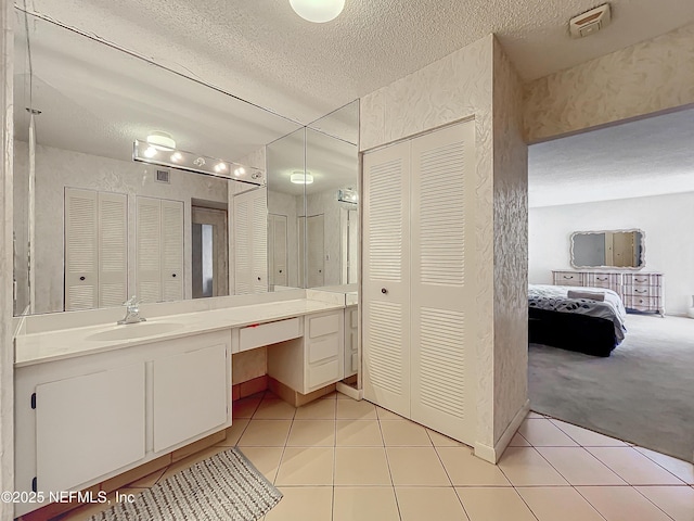 20225 NE 34th Ct Unit 817, Miami, FL 33810 - full bath with a textured ceiling, a closet, and tile patterned flooring
