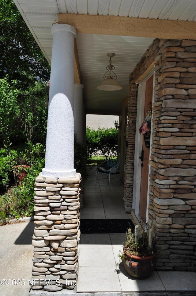 property entrance featuring covered porch