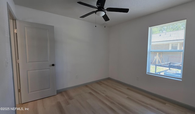 1625 W 27th St, Jacksonville, FL 32209 - unfurnished room with light wood finished floors and ceiling fan