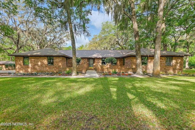 ranch-style home featuring a front yard