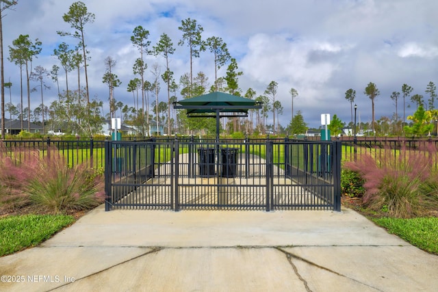 view of gate with fence