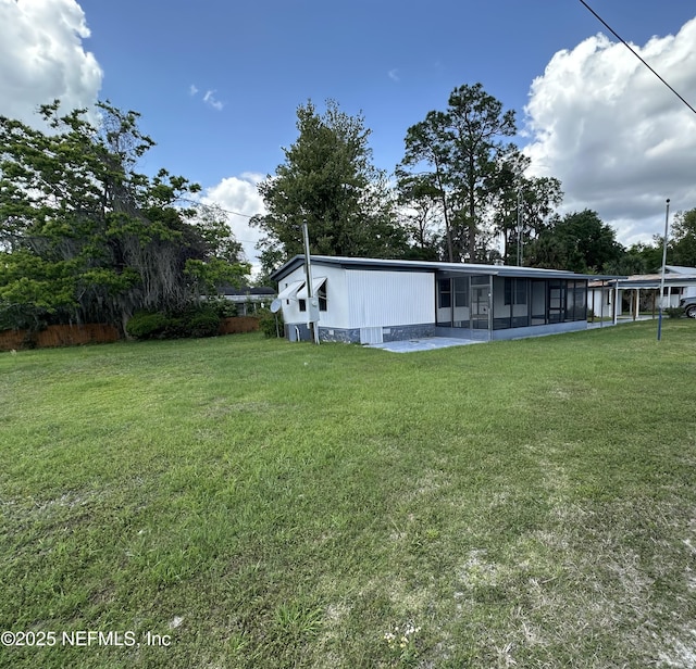 view of yard with a sunroom