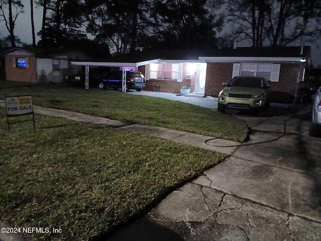 4123 Piper Dr, Jacksonville, FL 32207 - view of yard with a carport and driveway