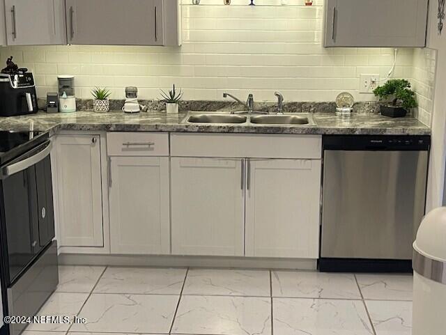 4123 Piper Dr, Jacksonville, FL 32207 - kitchen with range with electric cooktop, dishwasher, a sink, dark stone counters, and marble finish floor