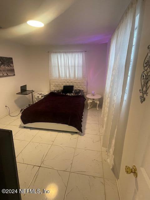4123 Piper Dr, Jacksonville, FL 32207 - bedroom with marble finish floor