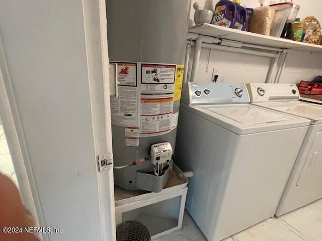 4123 Piper Dr, Jacksonville, FL 32207 - washroom with marble finish floor, water heater, washing machine and dryer, and laundry area