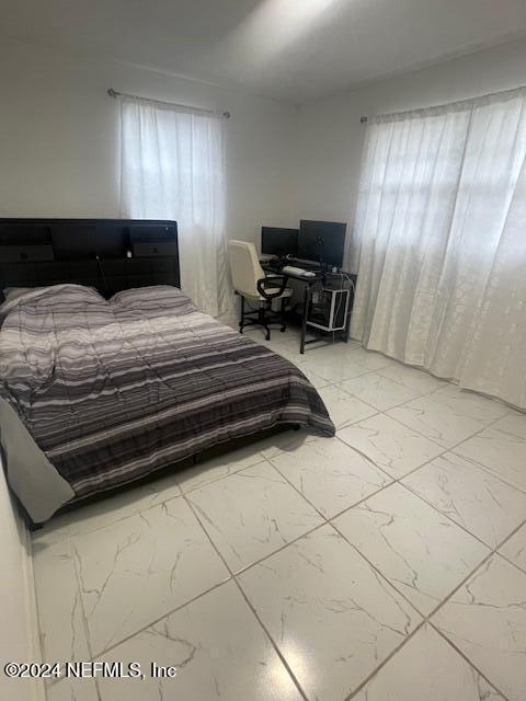 4123 Piper Dr, Jacksonville, FL 32207 - bedroom featuring marble finish floor