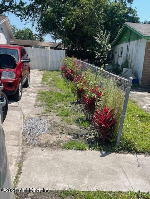 4123 Piper Dr, Jacksonville, FL 32207 - view of yard with fence and concrete driveway