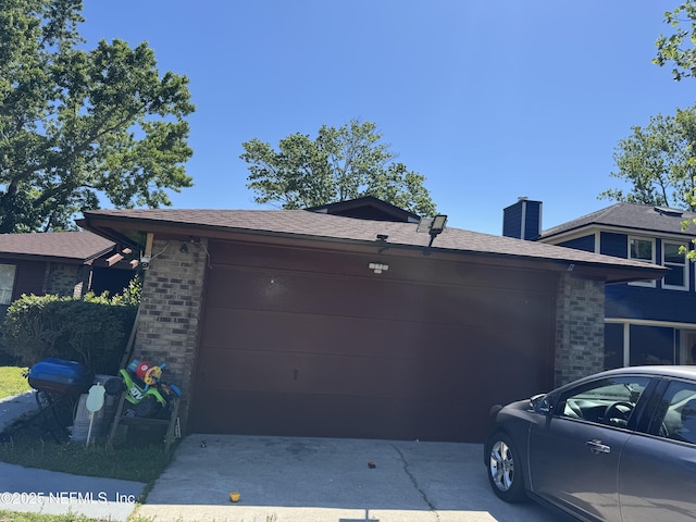 1717 Derringer Rd, Jacksonville, FL 32225 - exterior space featuring a garage, brick siding, a chimney, and driveway