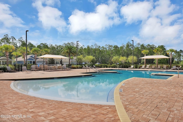 336 Spoonbill Cir, Saint Augustine, FL 32095 - community pool with a patio area and a hot tub