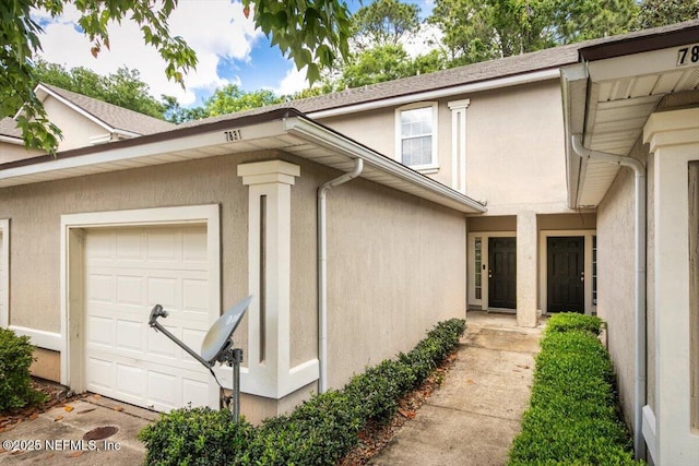 7831 Melvin Rd Unit 1, Jacksonville, FL 32210 - view of side of property with an attached garage and stucco siding