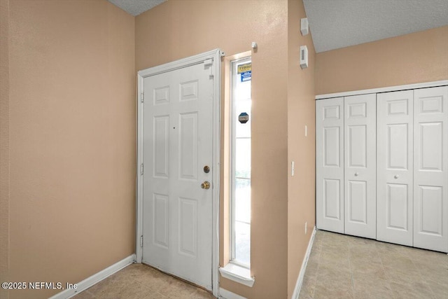 7831 Melvin Rd Unit 1, Jacksonville, FL 32210 - foyer with light tile patterned floors and baseboards