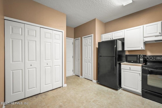 7831 Melvin Rd Unit 1, Jacksonville, FL 32210 - kitchen featuring a textured ceiling, white cabinets, black appliances, and under cabinet range hood