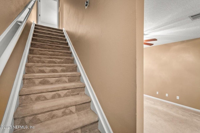 7831 Melvin Rd Unit 1, Jacksonville, FL 32210 - staircase with visible vents, ceiling fan, carpet flooring, and baseboards