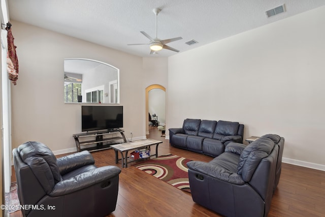 1542 Wescott Loop, Winter Springs, FL 32708 - living area with ceiling fan, arched walkways, wood finished floors, and visible vents