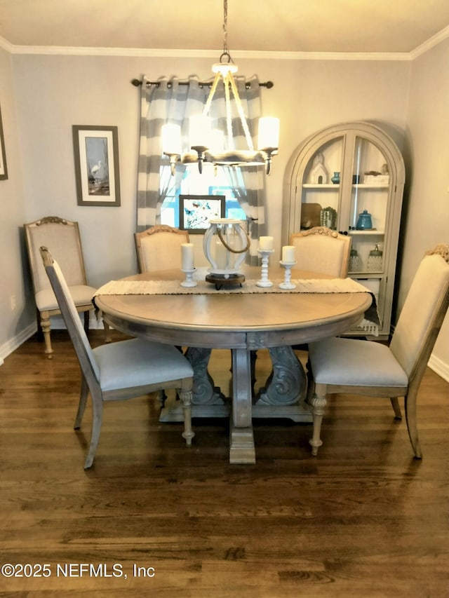 512 Clinton Dr, Orange Park, FL 32073 - dining room with wood finished floors, ornamental molding, baseboards, breakfast area, and a chandelier