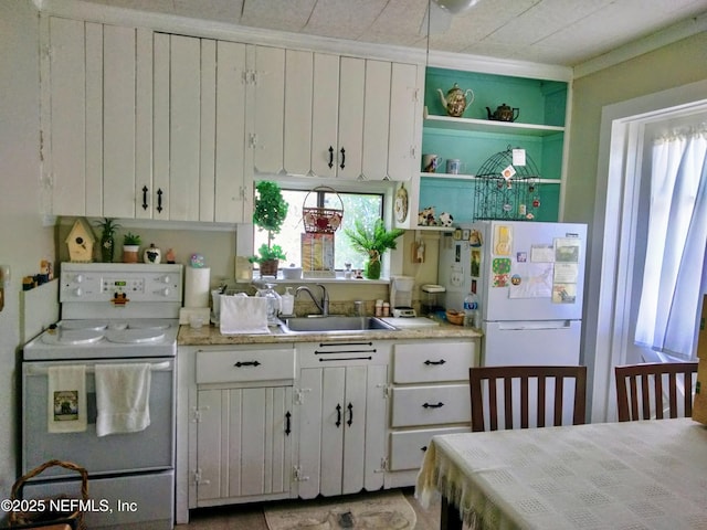 512 Clinton Dr, Orange Park, FL 32073 - kitchen with white appliances, open shelves, white cabinetry, light countertops, and a sink