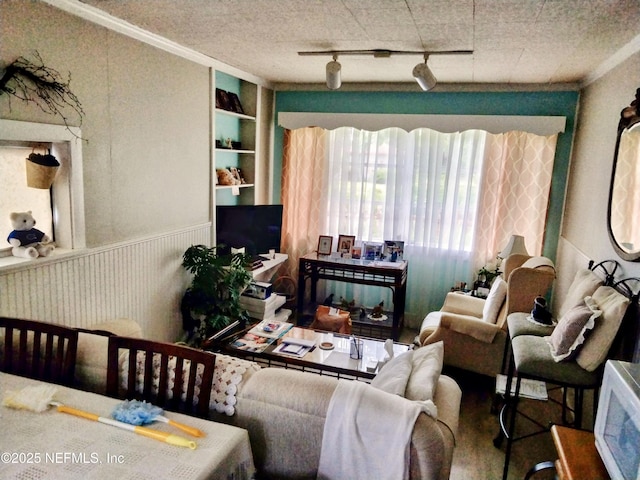 512 Clinton Dr, Orange Park, FL 32073 - living room with wainscoting, crown molding, built in features, and track lighting