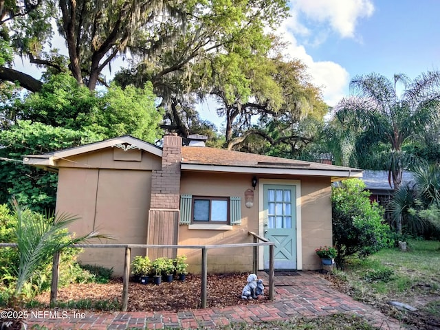 512 Clinton Dr, Orange Park, FL 32073 - single story home with a chimney and stucco siding