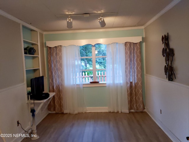 512 Clinton Dr, Orange Park, FL 32073 - interior space featuring wood finished floors, wainscoting, rail lighting, and crown molding