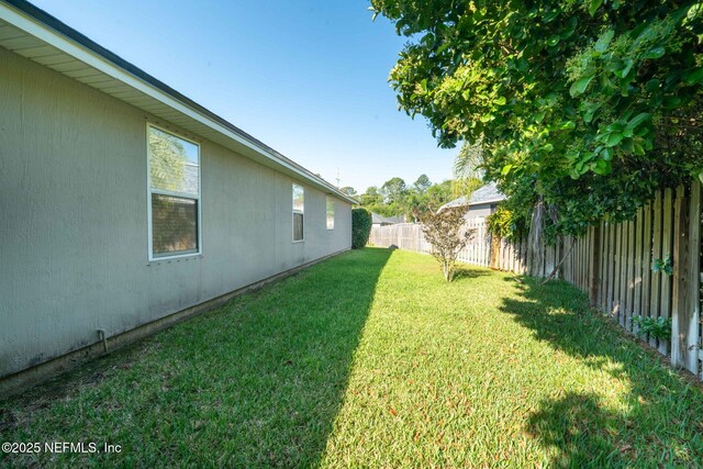 view of yard featuring a fenced backyard