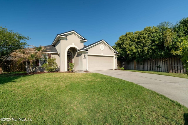 view of front of house featuring concrete driveway, stucco siding, a front lawn, a garage, and fence