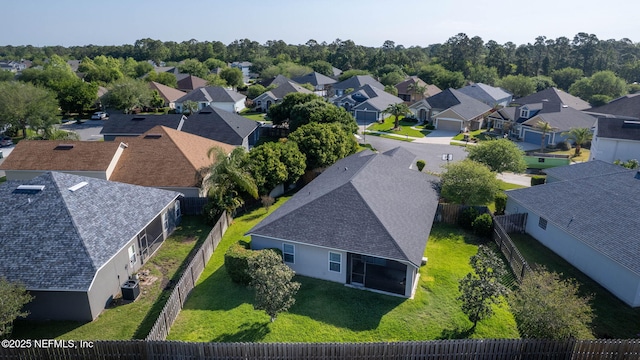birds eye view of property with a residential view