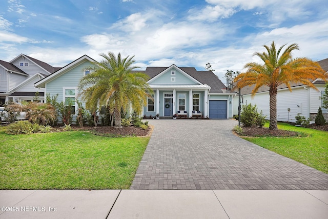 52 Sunshine Bass Ct, Ponte Vedra, FL 32081 - view of front of property featuring a front yard, decorative driveway, covered porch, and a garage
