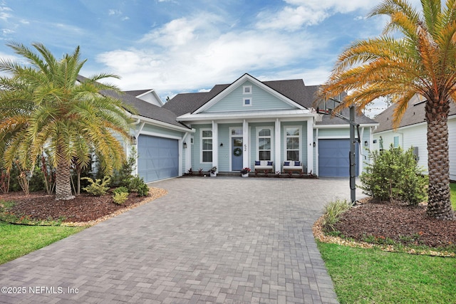52 Sunshine Bass Ct, Ponte Vedra, FL 32081 - view of front of property with a garage, a porch, a shingled roof, and decorative driveway