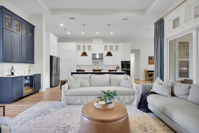 52 Sunshine Bass Ct, Ponte Vedra, FL 32081 - living room featuring beverage cooler, visible vents, light wood-style floors, recessed lighting, and indoor wet bar