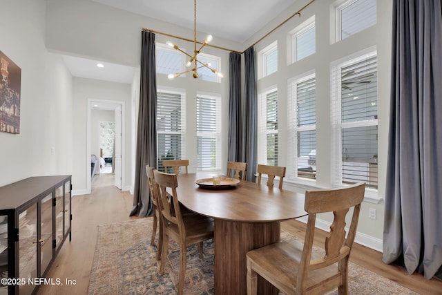 52 Sunshine Bass Ct, Ponte Vedra, FL 32081 - dining area featuring a chandelier, a healthy amount of sunlight, and light wood finished floors