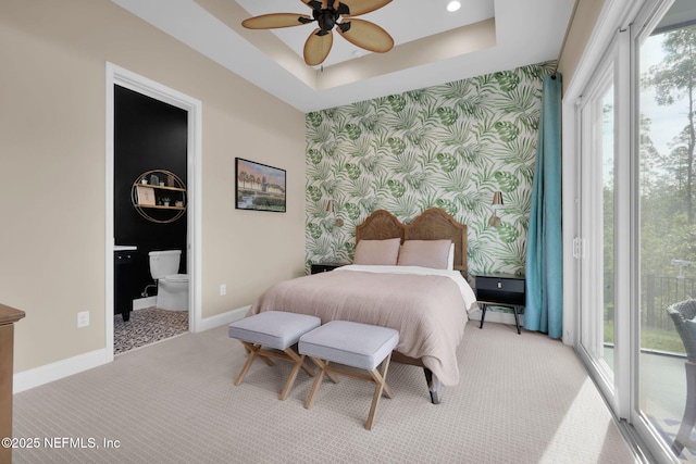 52 Sunshine Bass Ct, Ponte Vedra, FL 32081 - bedroom featuring a tray ceiling, baseboards, an accent wall, wallpapered walls, and carpet floors