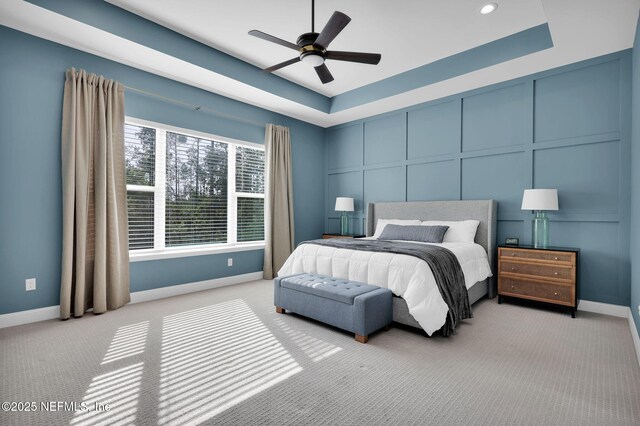 52 Sunshine Bass Ct, Ponte Vedra, FL 32081 - carpeted bedroom with a raised ceiling, a decorative wall, a ceiling fan, and baseboards