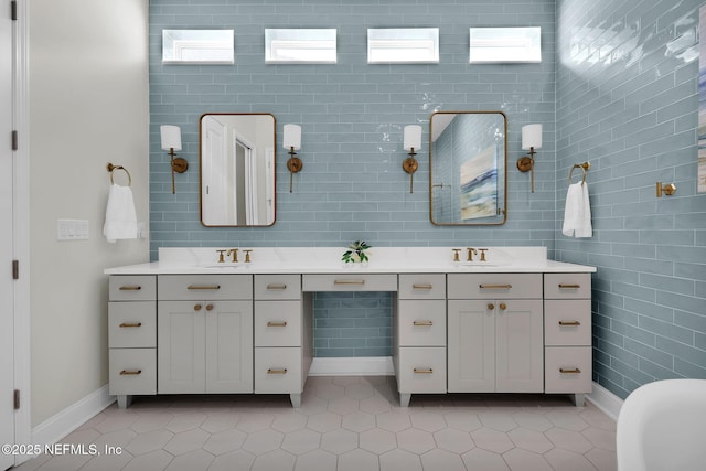 52 Sunshine Bass Ct, Ponte Vedra, FL 32081 - bathroom with baseboards, tile patterned floors, double vanity, and a sink