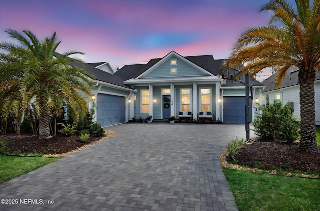 52 Sunshine Bass Ct, Ponte Vedra, FL 32081 - view of front of house with decorative driveway, covered porch, and a garage