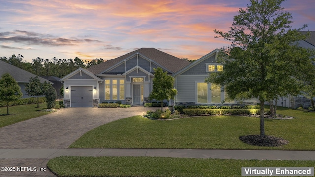 441 Anthem Ridge Dr, Ponte Vedra, FL 32081 - craftsman-style house featuring stone siding, an attached garage, a lawn, and driveway