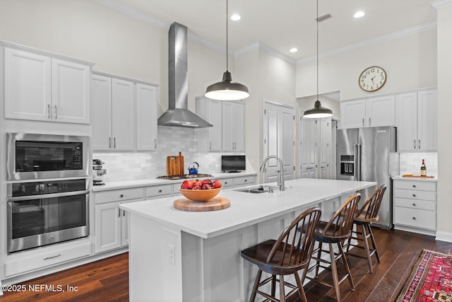 441 Anthem Ridge Dr, Ponte Vedra, FL 32081 - kitchen featuring crown molding, wall chimney exhaust hood, tasteful backsplash, visible vents, and appliances with stainless steel finishes