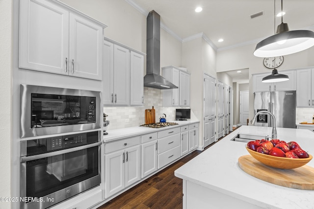 441 Anthem Ridge Dr, Ponte Vedra, FL 32081 - kitchen with ornamental molding, light countertops, wall chimney exhaust hood, stainless steel appliances, and a sink