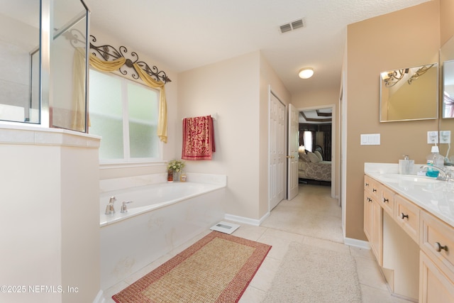13772 Chipperfield Ln, Jacksonville, FL 32226 - full bathroom featuring visible vents, vanity, ensuite bath, baseboards, and a garden tub
