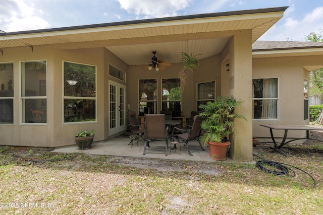 13772 Chipperfield Ln, Jacksonville, FL 32226 - rear view of property featuring stucco siding, a shingled roof, a patio, and ceiling fan