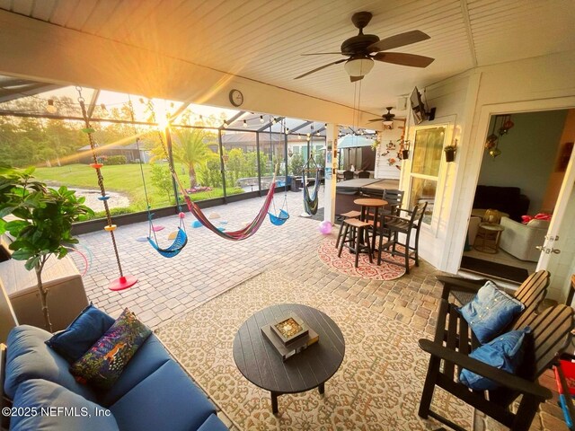 sunroom with an outdoor hangout area and ceiling fan