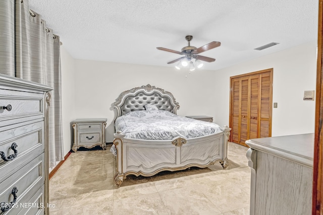 6982 Madrid Ave, Jacksonville, FL 32217 - bedroom with visible vents, a ceiling fan, a closet, and a textured ceiling