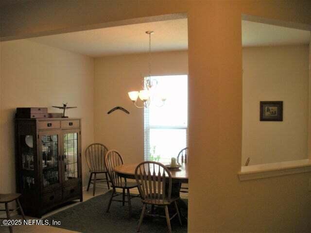 46 Molasses Ct, Jacksonville, FL 32259 - dining area featuring a notable chandelier