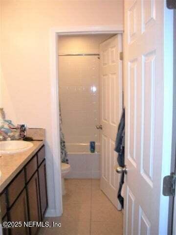 46 Molasses Ct, Jacksonville, FL 32259 - bathroom with double vanity, tile patterned flooring, shower / bath combination with curtain, toilet, and a sink