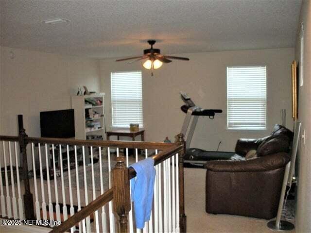 46 Molasses Ct, Jacksonville, FL 32259 - living room featuring carpet floors, ceiling fan, and a healthy amount of sunlight