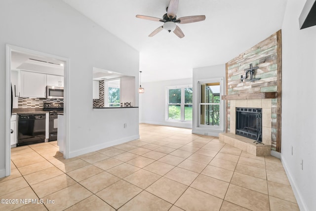 765 Sea Oats Bay, Ponte Vedra Beach, FL 32082 - unfurnished living room featuring baseboards, ceiling fan, light tile patterned floors, and a tile fireplace