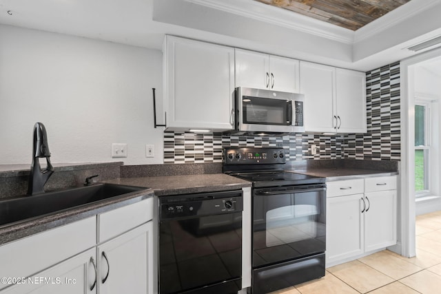 765 Sea Oats Bay, Ponte Vedra Beach, FL 32082 - kitchen with a sink, dark countertops, black appliances, and white cabinetry