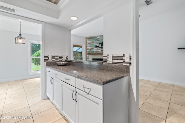 765 Sea Oats Bay, Ponte Vedra Beach, FL 32082 - kitchen featuring visible vents, white cabinetry, backsplash, and light tile patterned floors